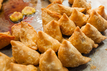 indian samosa, deep fried pastry filled with spicy vegetables,  close-up view