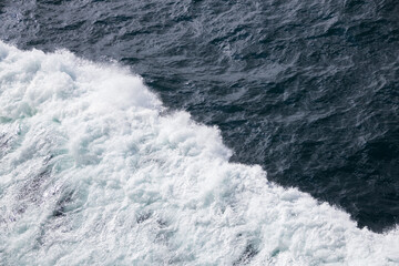Fototapeta na wymiar Waves in the ocean from a ship 