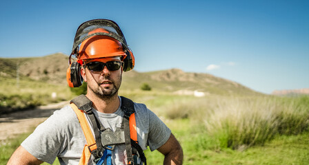 Portrait of a workerman wearing protective gear looking at the camera.