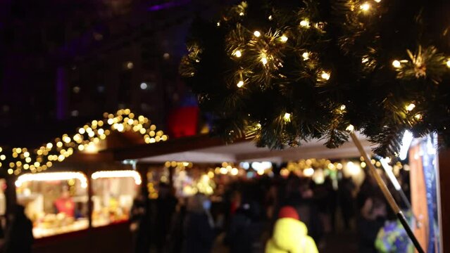 During Winter Berlin, Germany, there is a Christmas market in the Gendarmenmarkt at night, Advent Fair Decorations and stalls with craft items.