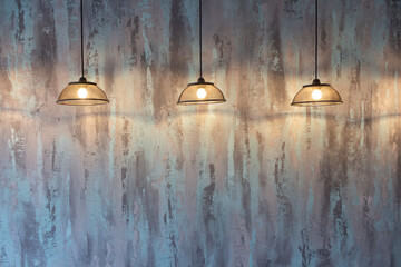 Lamps on the background of a multicolored painted wall