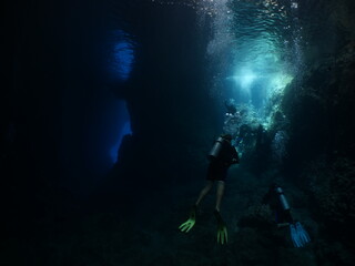 Fototapeta na wymiar sun beam and rays sun shine underwater in caves and caverns backgrounds scuba divers to explore