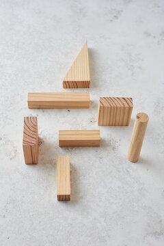 Top view of different Wooden set pieces on a white surface, skills building concept