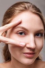 Fototapeta premium Pure skin for cosmetic products woman model blonde hair girl portrait isolated on white