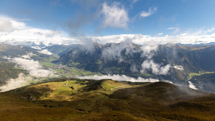 Fog, clouds, shadows over a mountain valley. Alpine landscape. Austria, Salzburg, Gastein