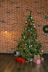 Interior of living room in loft is decorated with Christmas tree. Concept of Happy Christmas