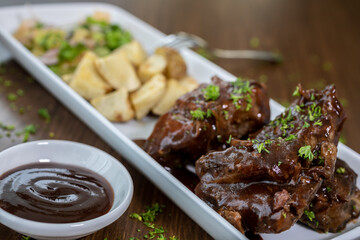 Typical colombian food and drinks, bbq ribs with helmet potatoes