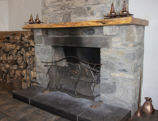 Old stone fire palce with copper ornaments