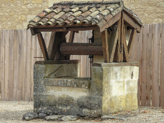 Old well with tile roof