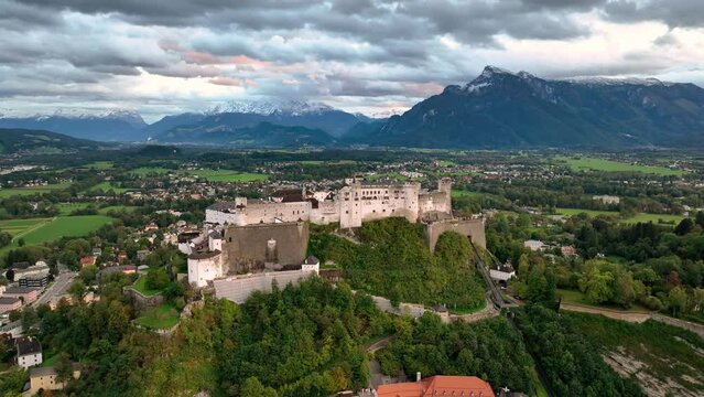 Salzburg Austria skyline of Salzburg castle river old town in 4k after sunset