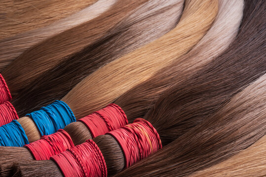 Hair Extensions. Sections of women's hair. Texture or background of beautiful female hair.
