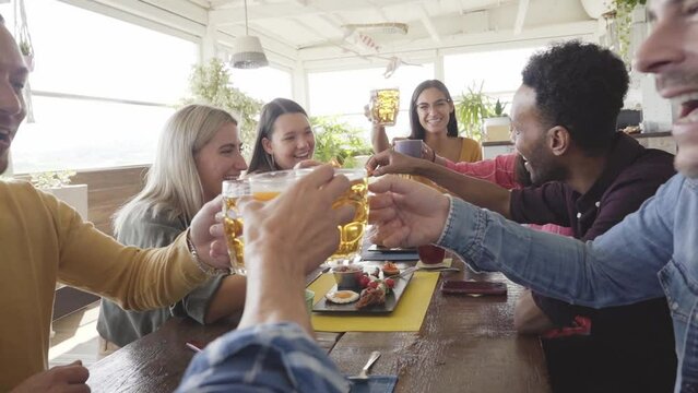 Top view of close up hands of Multicultural People having breakfast drinking coffee and cheers. Happy community fun together in a terrace bar. High quality photo