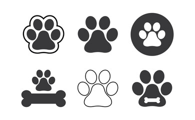 Fototapeta na wymiar Dog paw prints set. Black silhouettes of paw icons. Vector isolated illustration