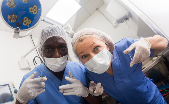 Man and woman veterinarians with equipment in a veterinary clinic