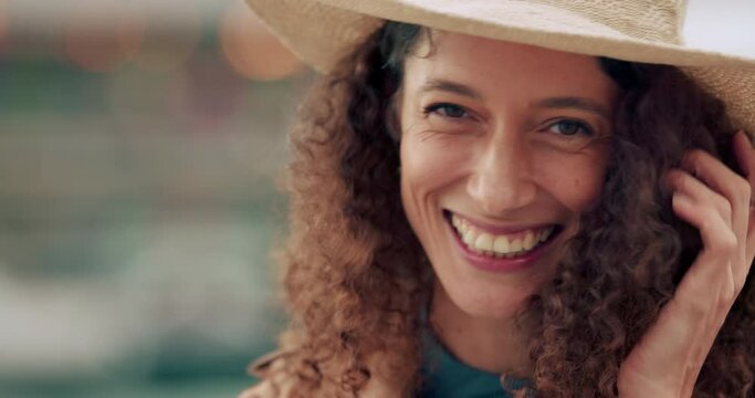 Laughing, face or fashion woman in city with curly hairstyle, style hat or urban trend clothes. Portrait, smile or happy tourist in windy travel location of Israel for relax holiday vacation or break