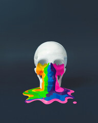 Skull with vivid paint which is dripping, leaking and pouring on dark background .Trendy Spooky...