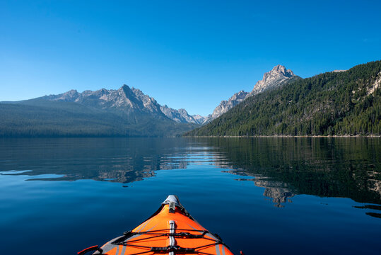 USA, Idaho, Redfish Lake. Kayak facing Sawtooth Mountains.