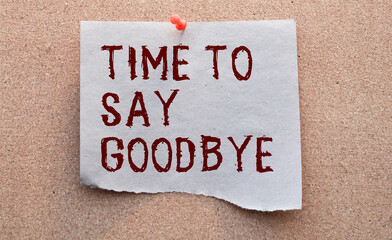 The text Time to say goodbye appearing behind torn brown paper