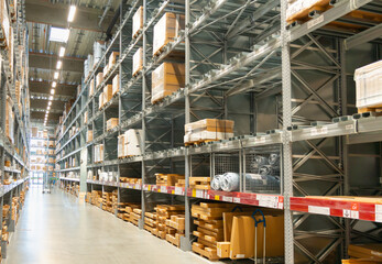 Boxes on shelves in the corridor of a modern large logistics warehouse or store