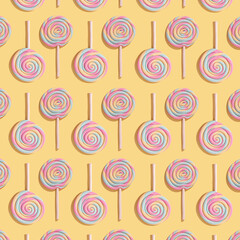 Fototapeta na wymiar Colorful pattern made of lollipops on a pastel yellow background. Flat lai. The concept of sweets.