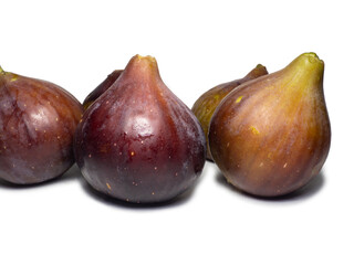 Ripe figs on a white background. Several figs. Southern fruit isolate. Purple fruit. Healthy diet. For diet