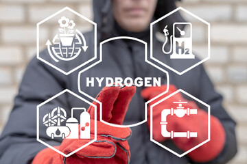 Industry worker using virtual touchscreen presses word: HYDROGEN. Concept of hydrogen innovative...