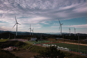 Beautiful Harmony of Wool Clouds and Wind Farms