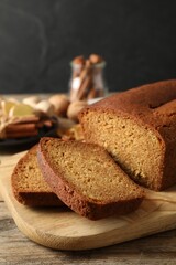 Fresh sliced gingerbread cake on wooden table