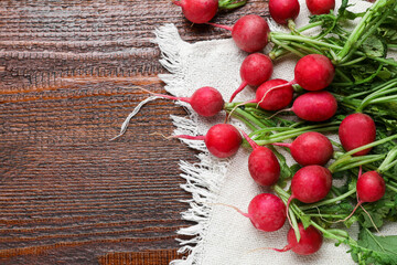 Fototapeta na wymiar Fresh ripe radish on wooden table, flat lay. Space for text