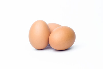three chicken eggs on white background