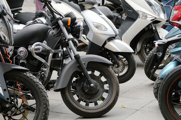 Fototapeta na wymiar Black chopper with other motorbikes on street