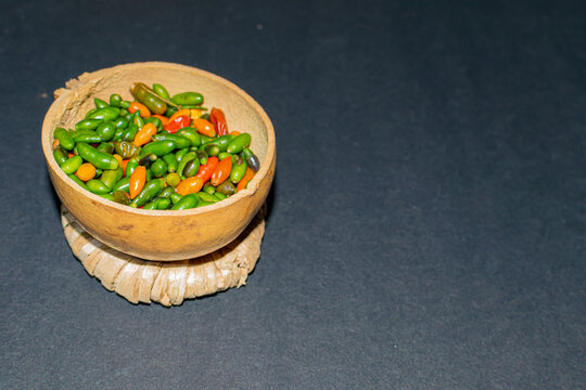 chiltepin chili presented in a traditional jicaro container
