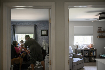 Obraz premium Marine veteran with service dog and family living life.