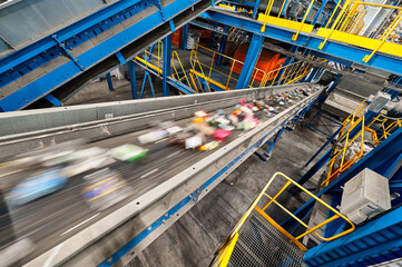 Conveyor belt transports sorted litter at recycling plant - 534372941