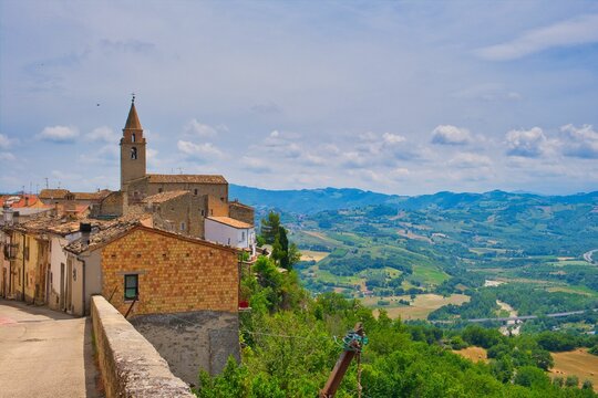 Gorgeous view of the town of Miano in Teramo, Abruzzo with lush green fields on a sunny day in Italy