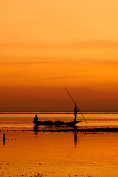 Seaweed Farmers In Nusa Lembongan Transferring Seaweed On A Boat