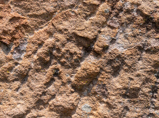Laterite stone background in red, orange or dark brown. general porous It is an important material in construction in the past. Because it is soft and hard enough. abstract background.