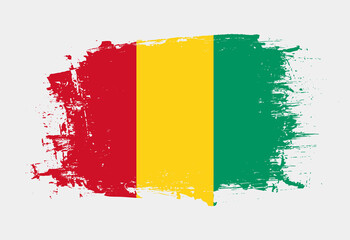 Brush painted national emblem of Guinea country on white background