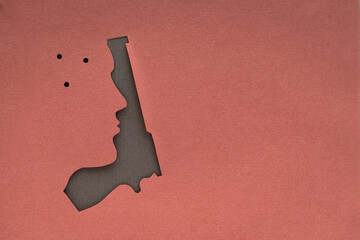 paper cut human face with gun silhouette texture background. STOP GUN VIOLENCE and killings...