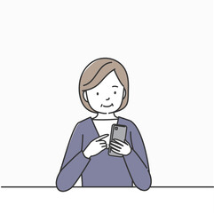 スマートフォンを操作する中高年の女性