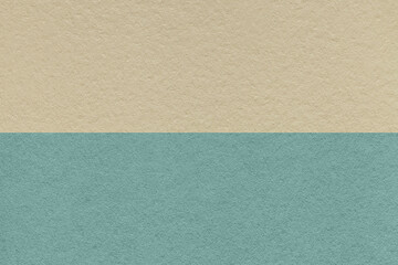 Fototapeta na wymiar Texture of craft beige and blue paper background, half two colors. Vintage brown and cerulean cardboard.
