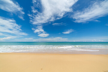 scenery white cloud in blue sky above long white beach..beautiful nature on the beach..smooth waves from green sea background.