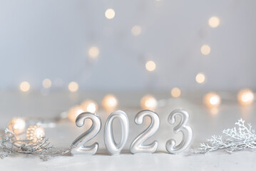 happy new year 2023 background new year holidays card with bright lights,gifts and bottle of...