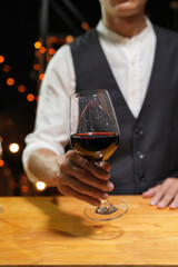 Bartender Serve wine, on wood bar, 