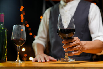 Bartender Serve wine, on wood bar, 