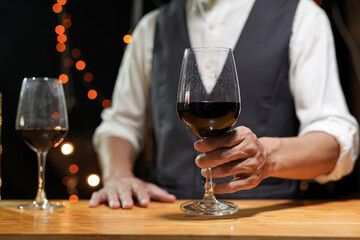Bartender Serve wine, on wood bar, 