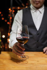 Bartender Serve wine, on wood bar, 
