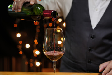 Bartender Serve wine, on wood bar, 