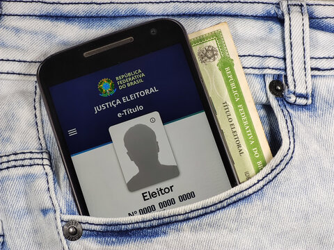  In this photo illustration the e-T&iacute;tulo app logo seen displayed on a smartphone in the pocket of jeans.