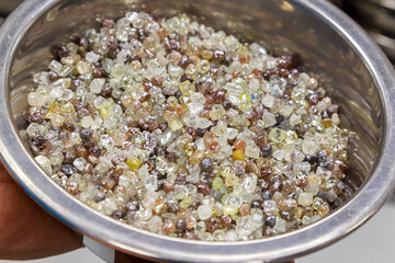 Beautiful rough diamonds in bowls.